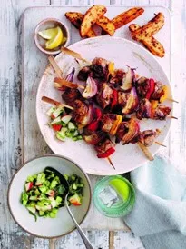 Lamb chunks cooked on skewer with onions and paper on a plate with side of rustic chips and salsa Copyright - all rights reserved - Simply Beef and Lamb. Permission to use kindly granted by AHDB Simply Beef and Lamb Recipes website URL https://www.simplybeefandlamb.co.uk/recipes/honey-and-mustard-lamb-kebabs-with-cucumber-salsa/ Lamb chunks cooked on skewer with onions and paper on a plate with side of rustic chips and salsa Copyright - all rights reserved - Simply Beef and Lamb. Permission to use kindly granted by AHDB Simply Beef and Lamb Recipes website URL https://www.simplybeefandlamb.co.uk/recipes/honey-and-mustard-lamb-kebabs-with-cucumber-salsa/